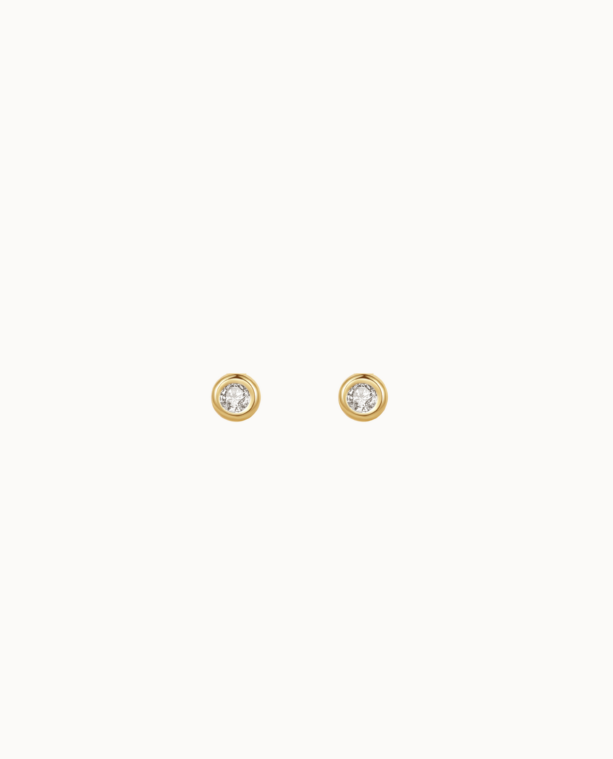 Agua Petite Studs in 18K gold-plated sterling silver with one clear cubic zirconia