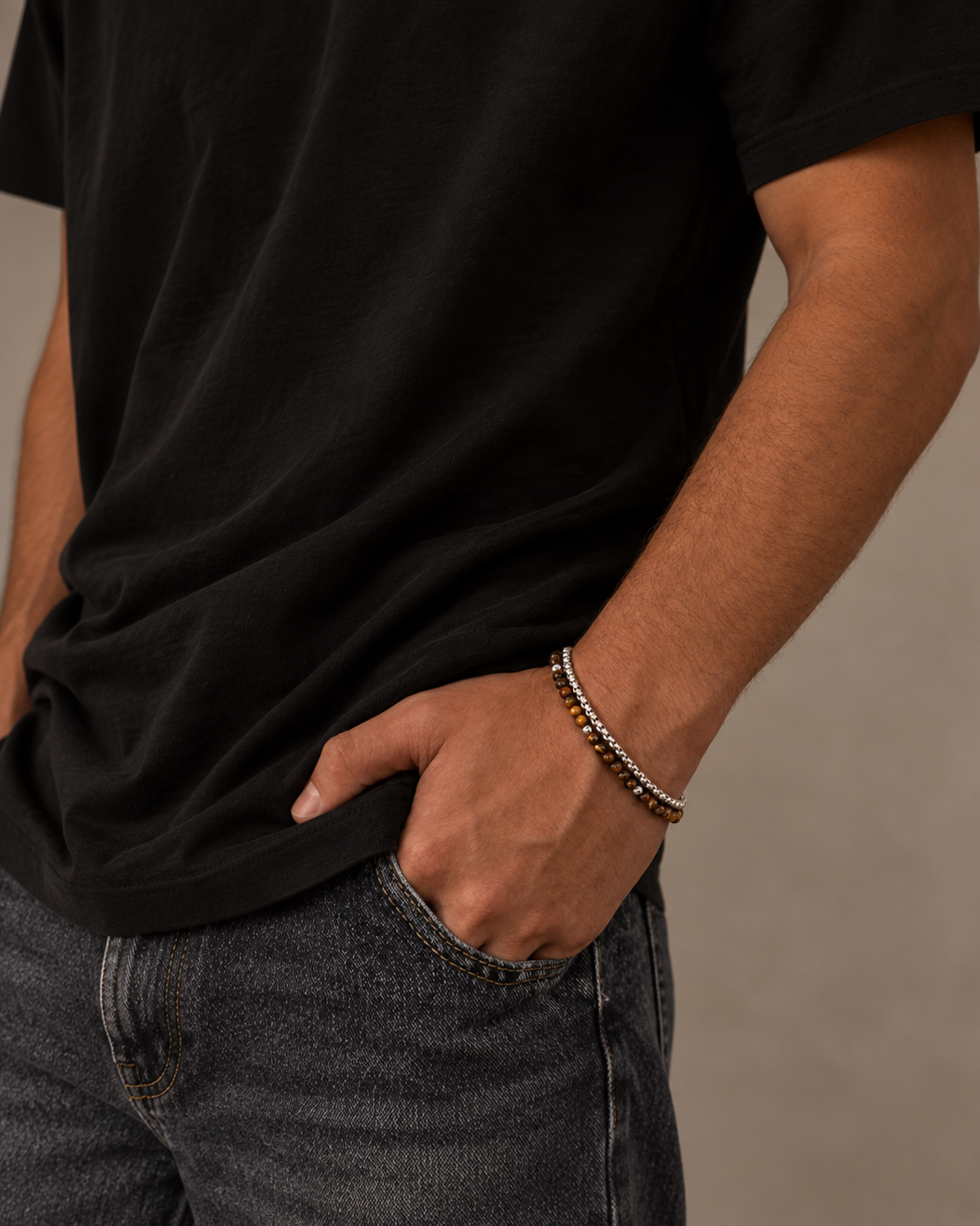 Detail of Ares men's bracelet with brown tiger's eye beads in a layered look