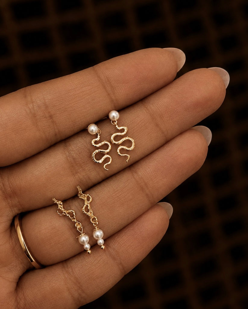 Astika oorbellen van verguld 925 sterling zilver – gedraaide slang en schelpparel