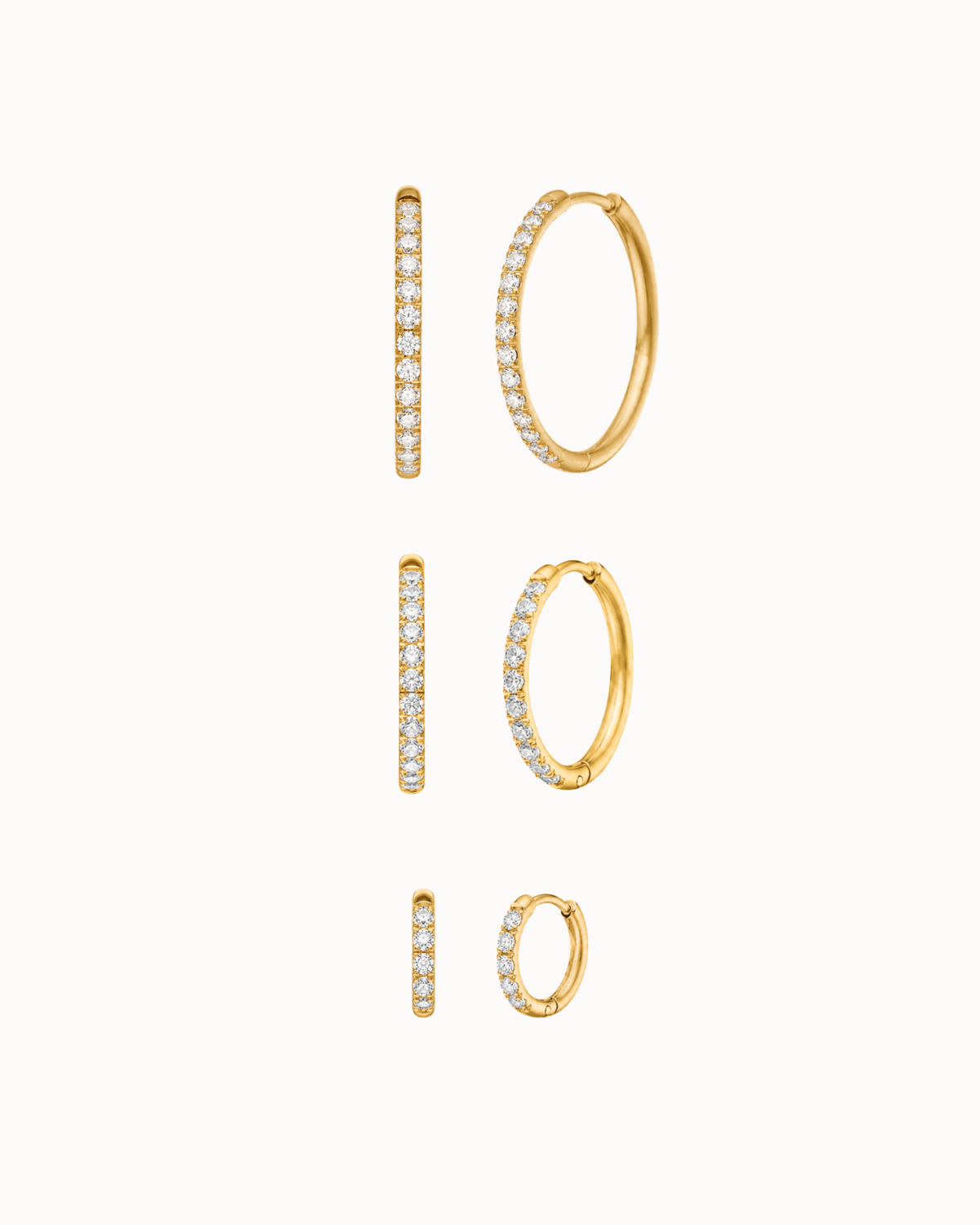 Belle Earrings Stack Set with three pairs of 14K gold-plated hoops with clear zirconia