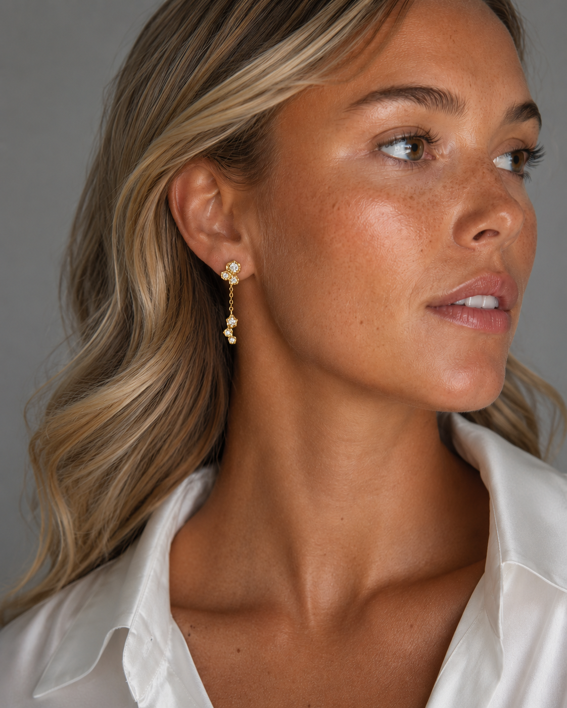 Delicate gold-plated Elara earrings with zirconia