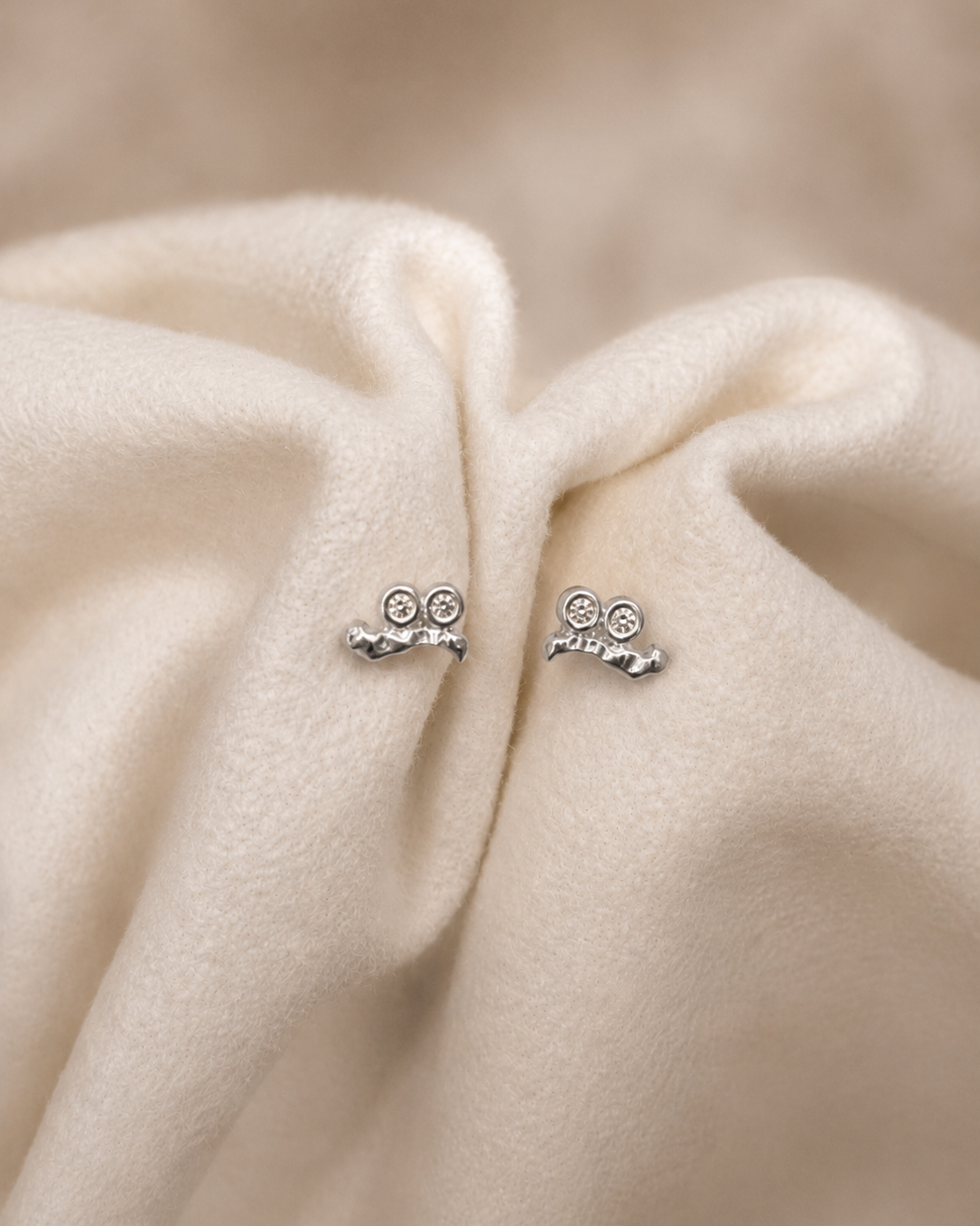 Horea Petite studs in 925 sterling silver – raw texture and sparkling zirconia