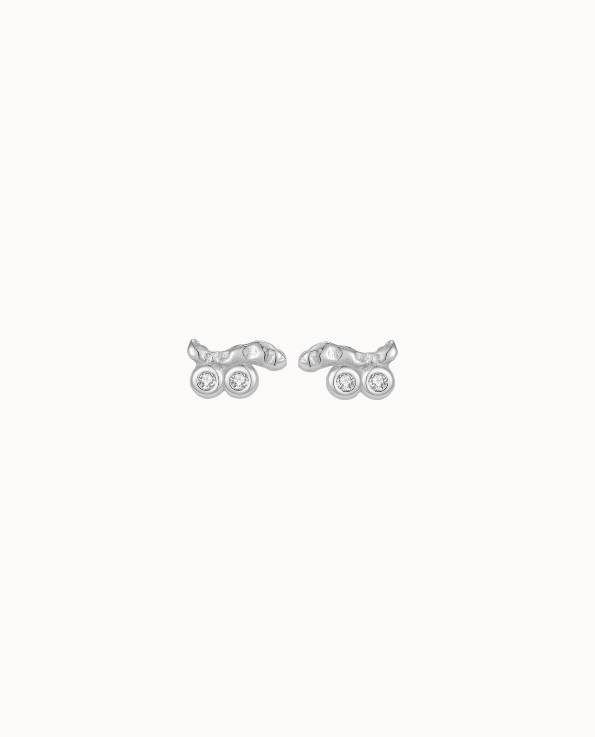 Horea Petite studs in 925 sterling silver with organic texture and two zirconia