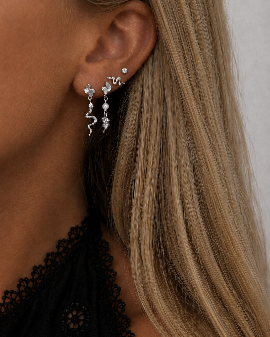 Kaa earrings with textured pendants and a shell pearl in 925 sterling silver