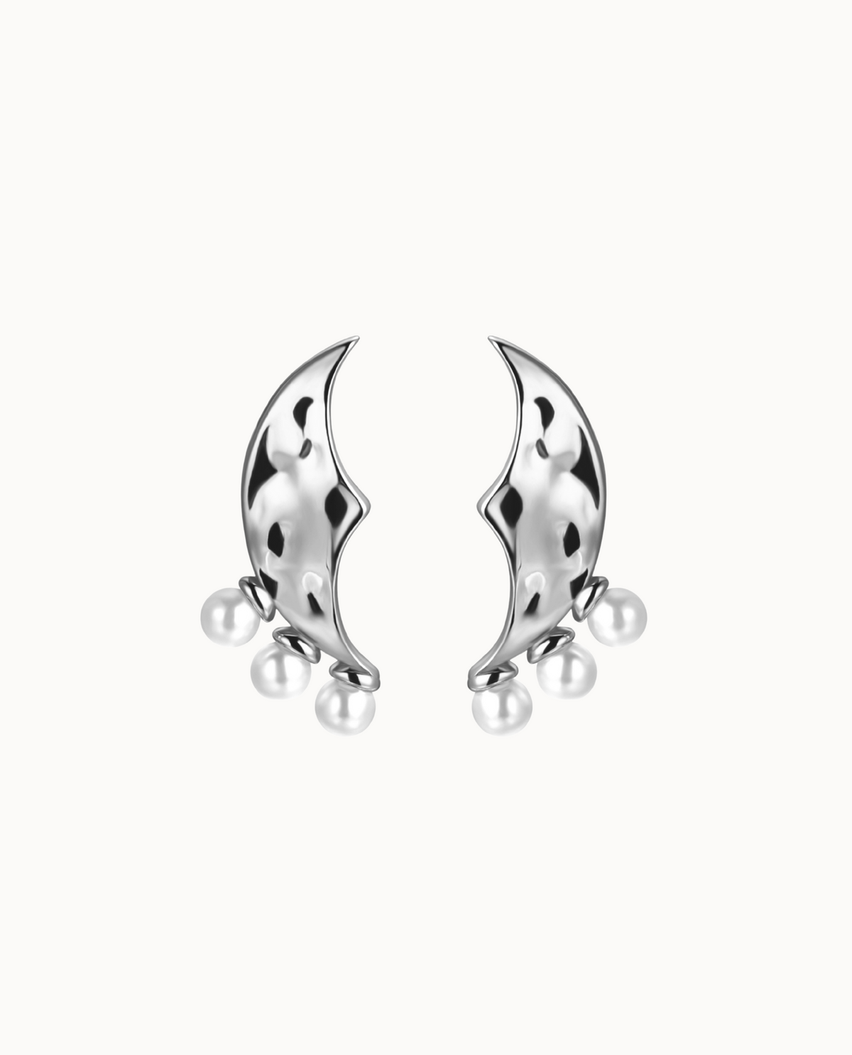 Luna Earrings in 925 sterling silver shaped like a moon with three small pearls