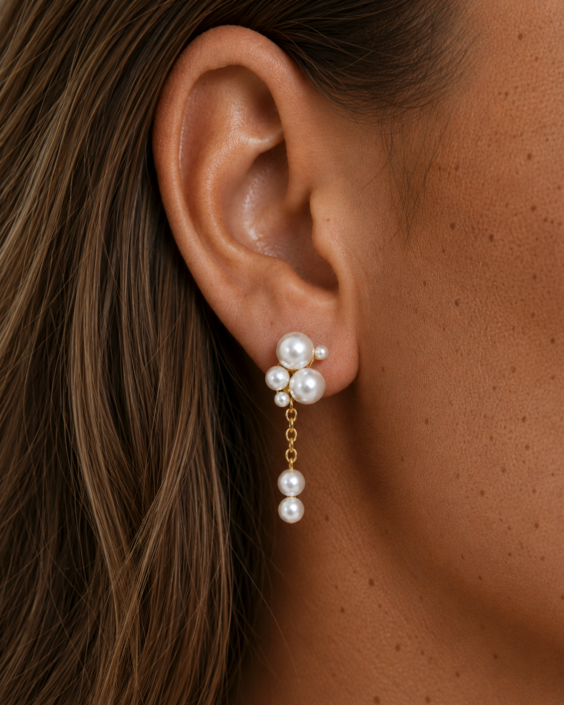 Marella earrings with pearls in different sizes in a gold-plated version