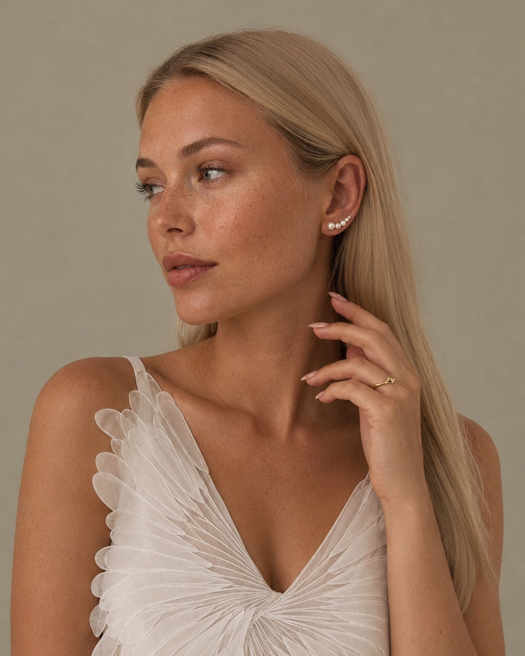 Gold-plated Varuna ear climber that sits up along the ear