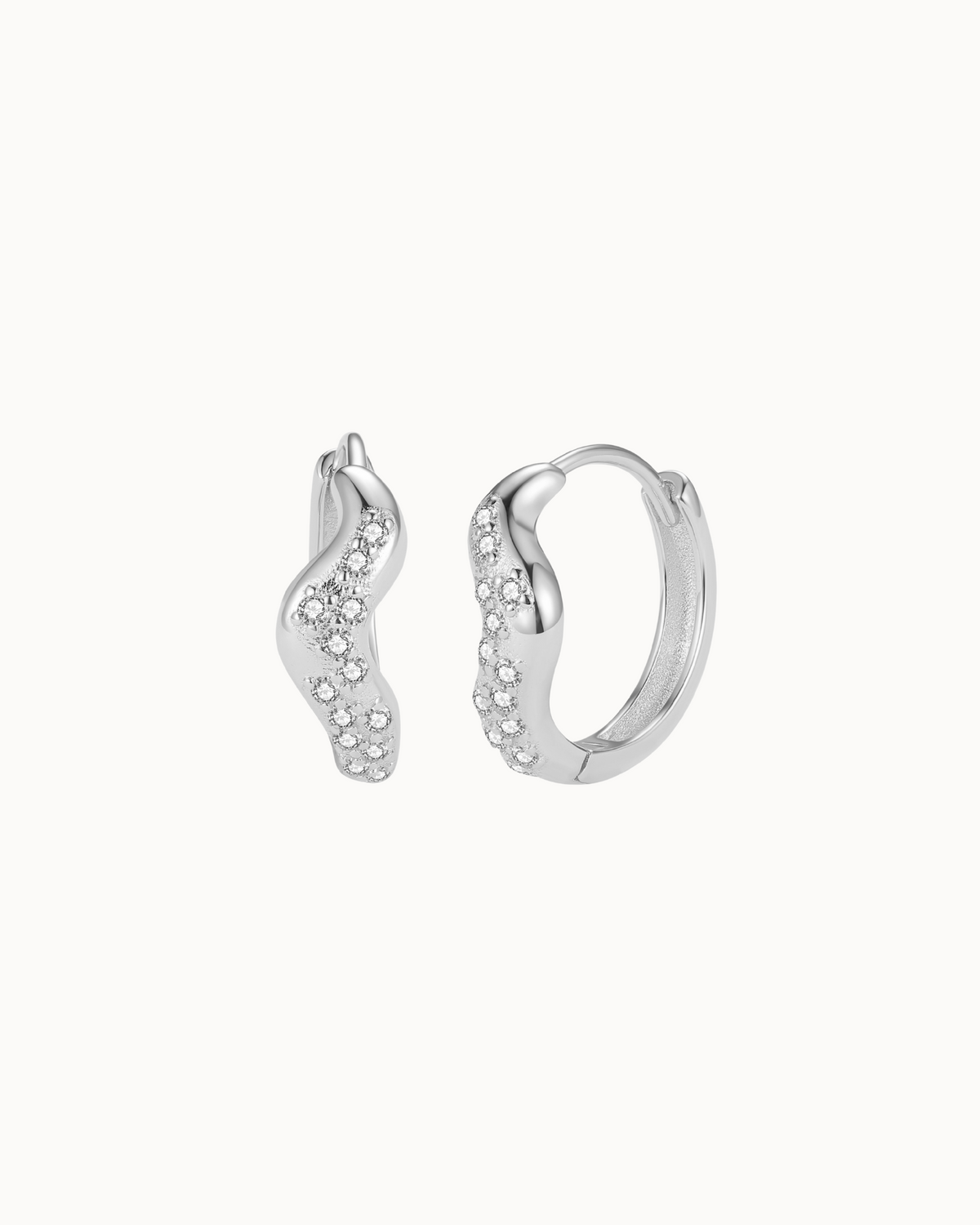 Vega Earrings in 925 sterling silver – wavy hoops filled with zirconia