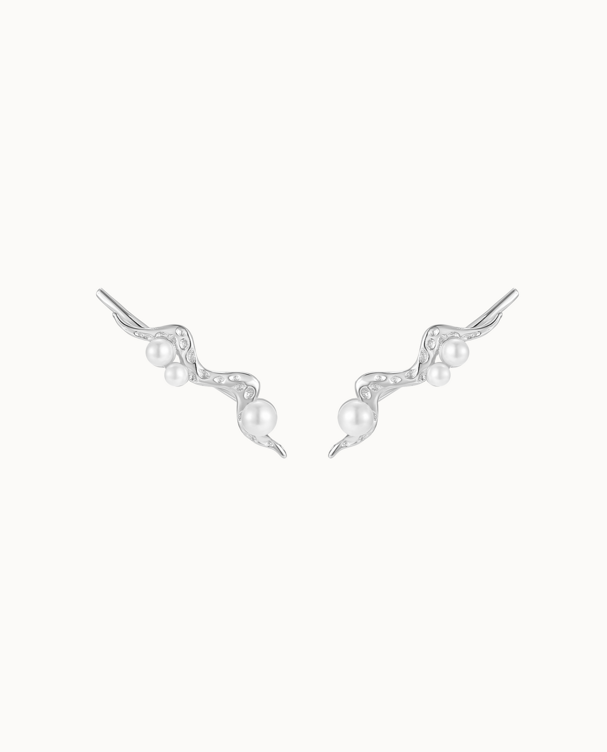 Zephyr ear climbers in 925 sterling silver with small pearls along the curve of the ear
