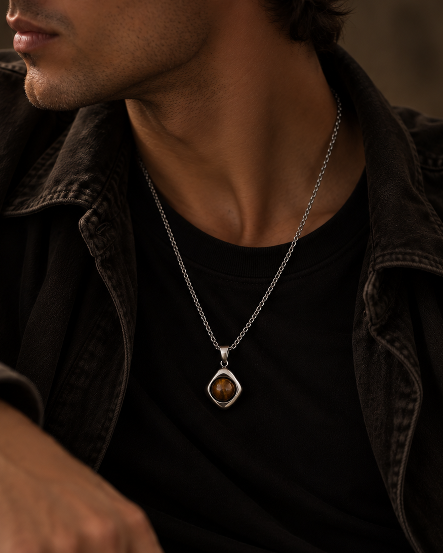 Cosmo necklace with brown pendant in an atmospheric portrait of a man
