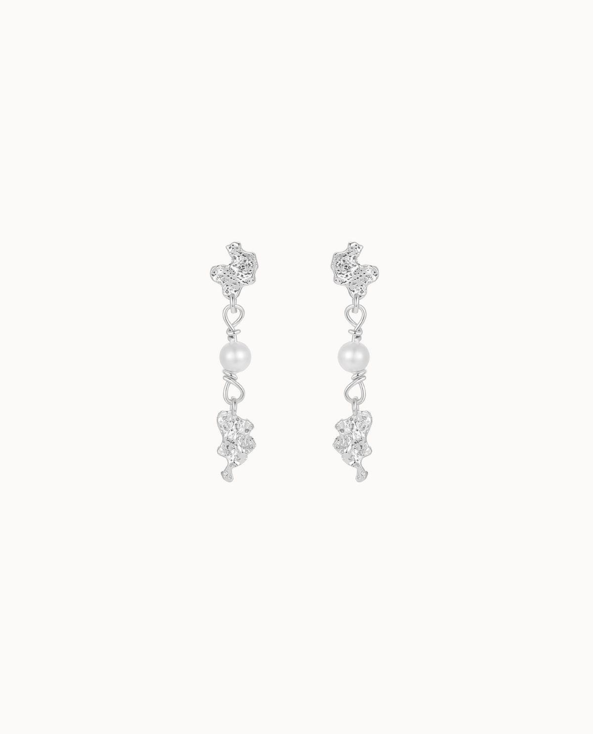 Kaa earrings in 925 sterling silver with textured pendants and a shell pearl