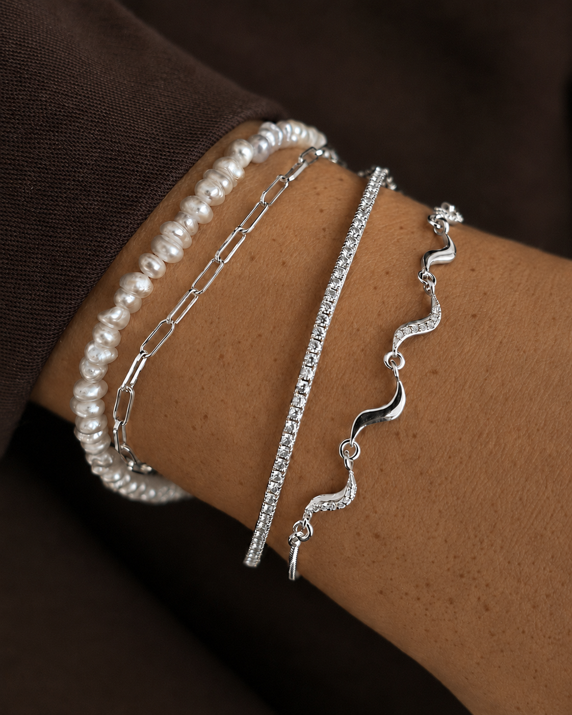 Nova armbånd i sterlingsølv med små vedhæng