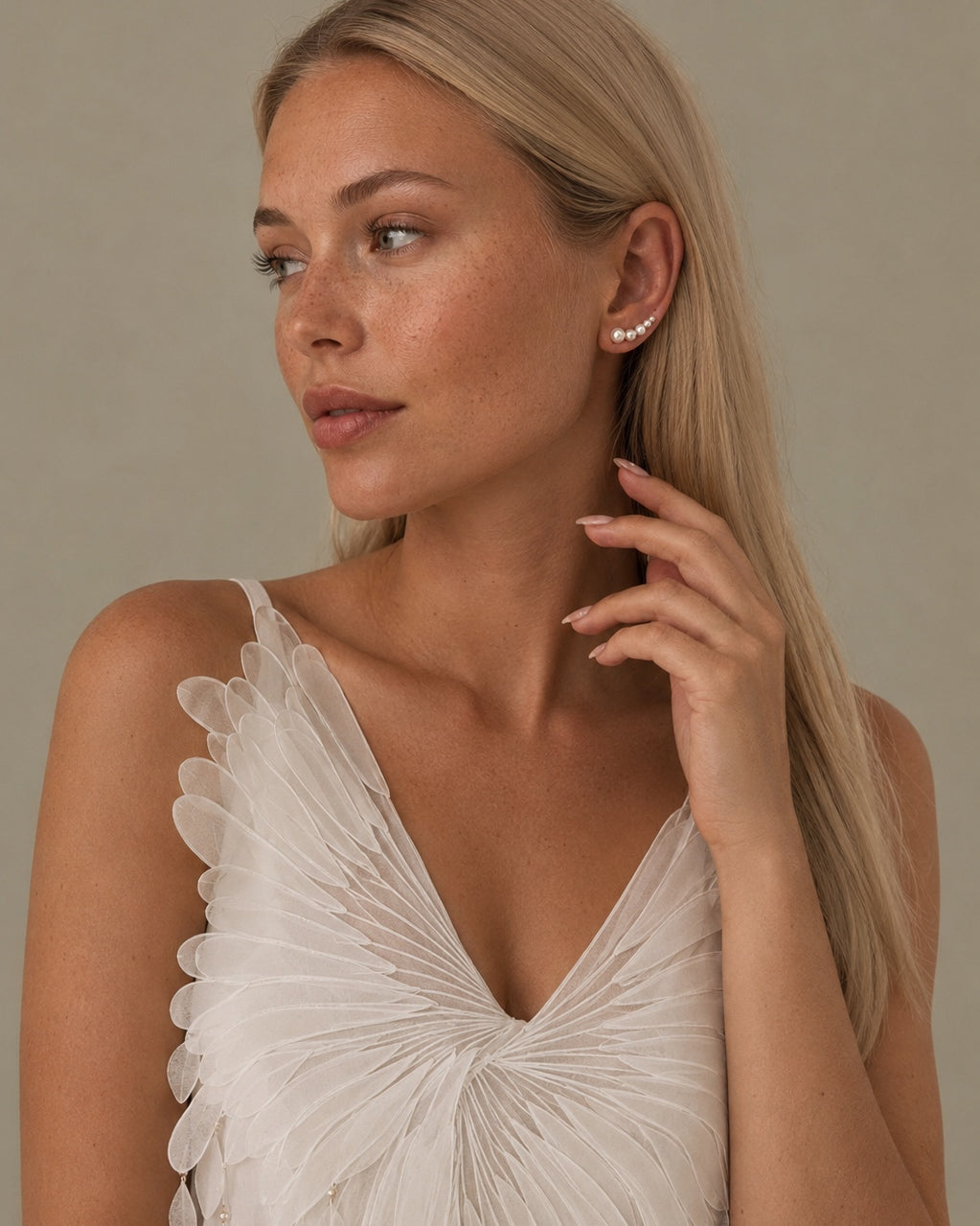 Elegant Varuna 925 sterling silver ear stud that follows the ear with small pearls