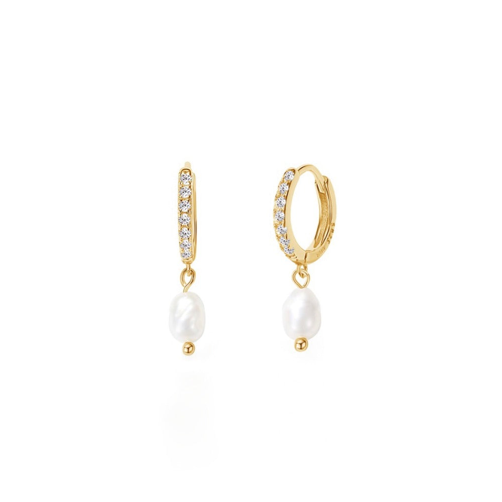 Elsa Earrings are beautiful huggie earrings with clear cubic zirconia and small freshwater pearls. The earring is beautiful alone or styled with other earrings. The earrings are easy to put in because of the huggie style. It is a perfect everyday earring.  