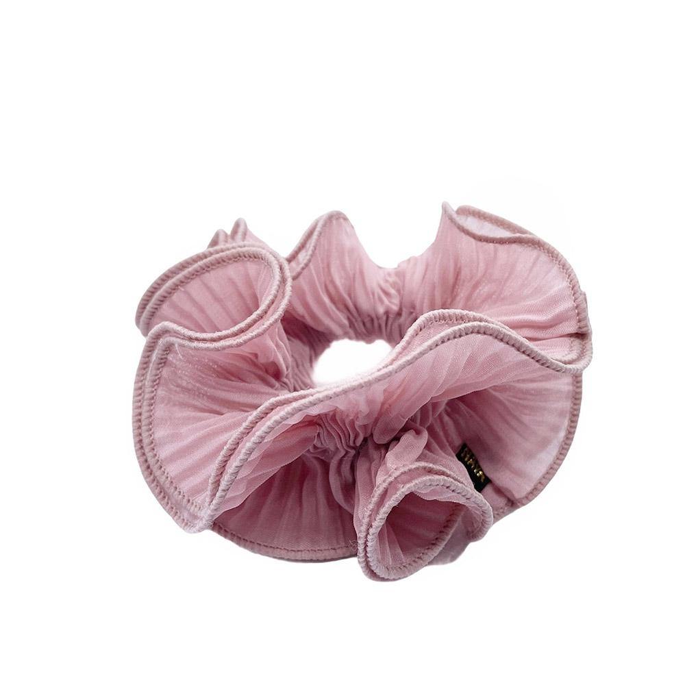 Sia scrunchie is a must have in your accessory collection! It's an oversized scrunchie which creates a puffy look in your hair. Use it in a messy bun or to spice up your ponytail.  